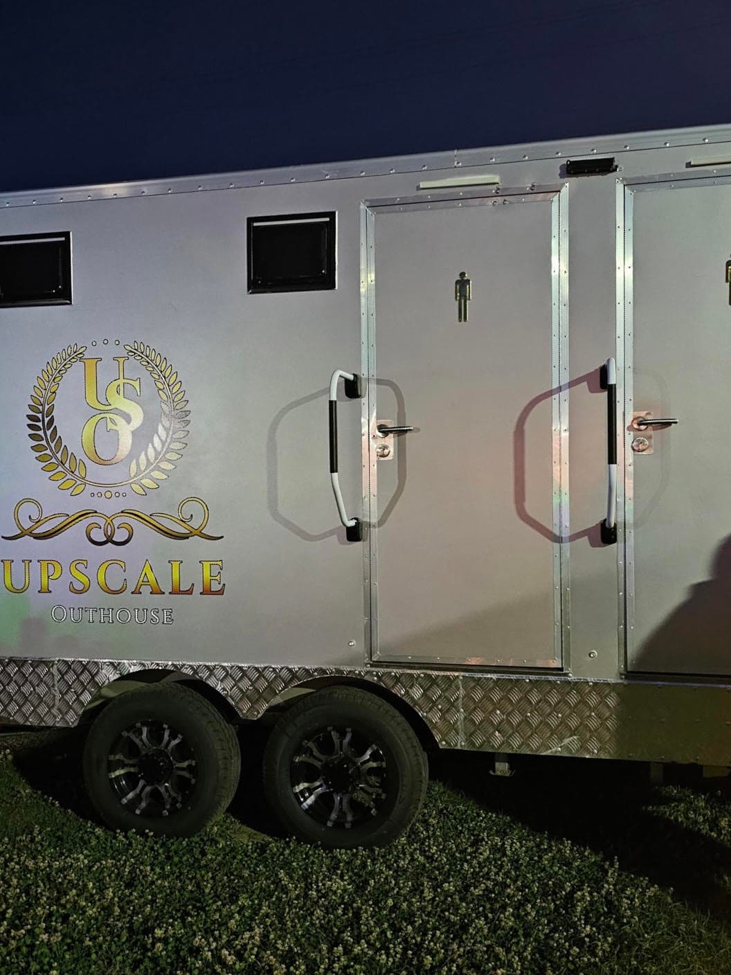 Luxury trailer illuminated at night with warm ambient lighting
